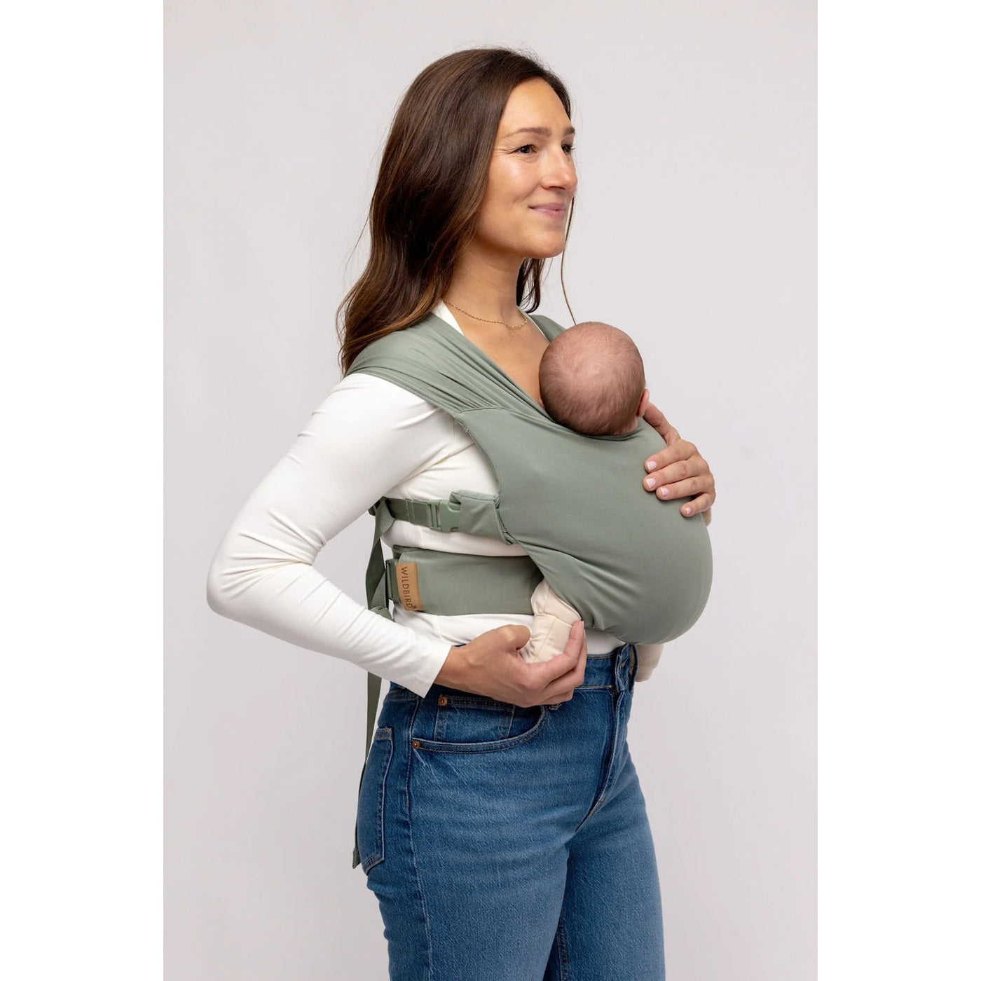 WildBird Aerial buckle wrap newborn baby carrier in the Acadian sage colourway, worn front carry