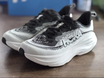 HOKA Skyflow women's US 6 running shoe in black and white with PROFLY midsole, wide base, and engineered mesh upper