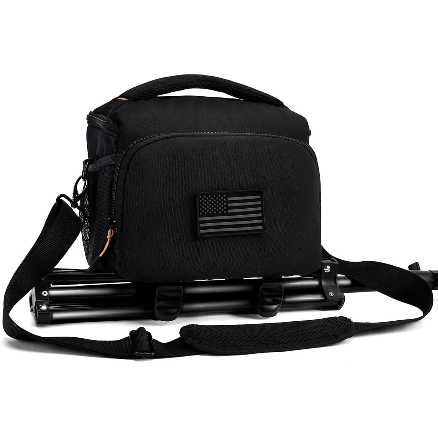 AMOZZ black camera sling bag with a tripod strapped underneath and shoulder strap