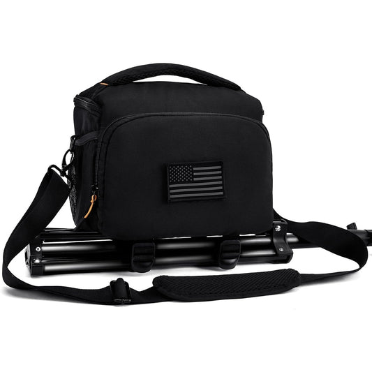 AMOZZ black camera sling bag with a tripod strapped underneath and shoulder strap